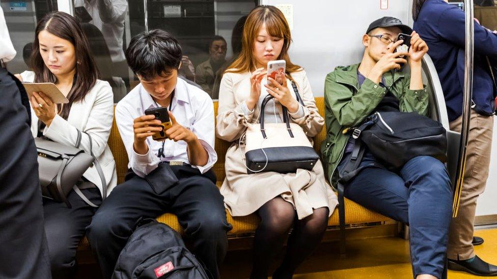 Japan, Honshu, Tokyo, Subway Passengers