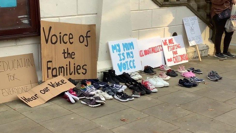 Shoes laid outside Sefton Council meeting