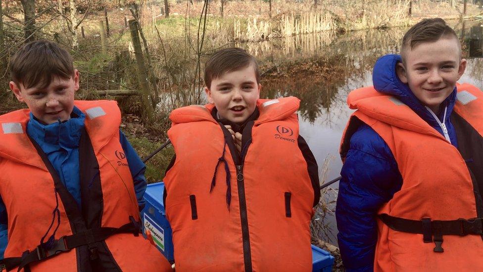 three students in life vests