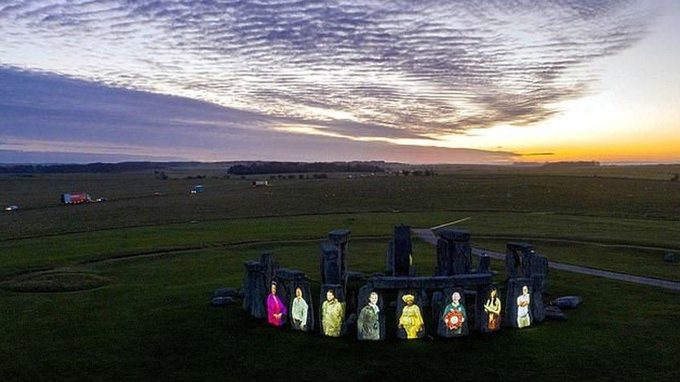 Stonehenge with faces on it.