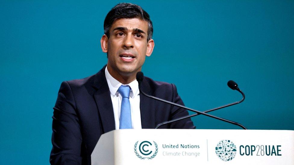 British Prime Minister Rishi Sunak delivers a national statement at the World Climate Action Summit during the United Nations Climate