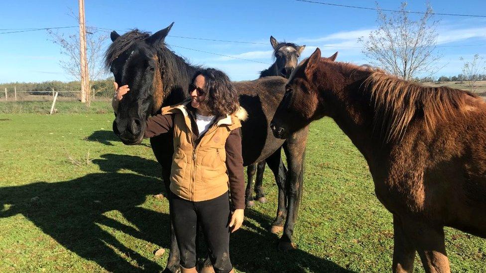 Delphine Chriqui with her horses