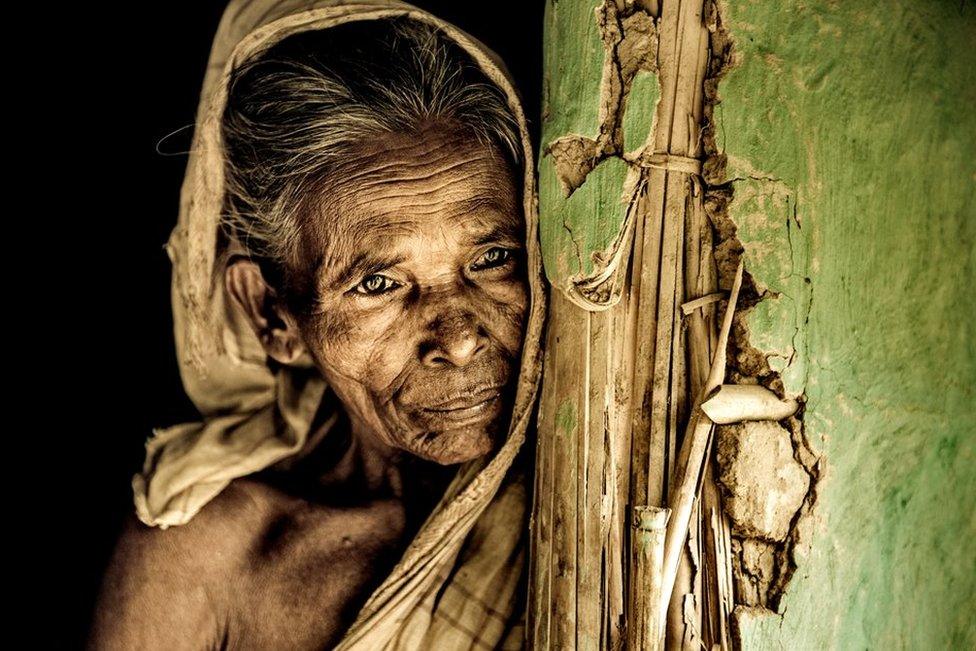 A woman at her home in Jaintapur, Sylhet, by mmz_Khan