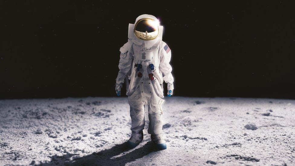 Astronaut standing on the moon surface