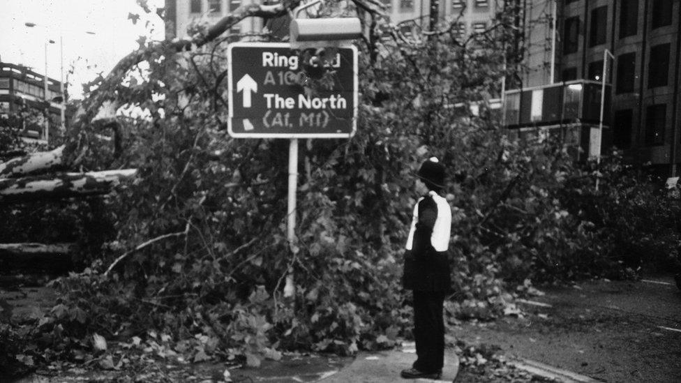 Policeman surveys damage in London