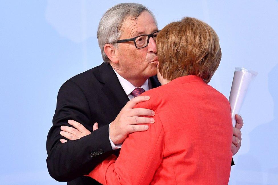 German Chancellor Angela Merkel (R) and President of the European Commission Jean-Claude Juncker at the official reception to the opening day of the G20 summit in Hamburg, 7 July