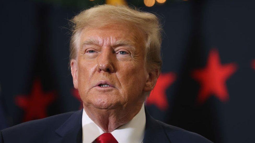 Republican presidential candidate and former U.S. President Donald Trump looks on during a campaign event on December 19, 2023 in Waterloo, Iowa.