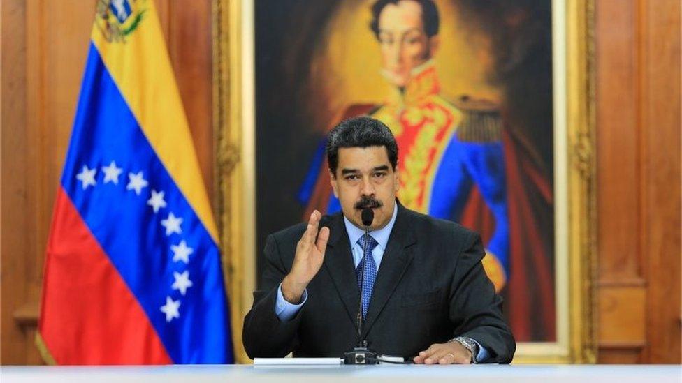 handout picture released by the Venezuelan presidency showing Venezuelan President Nicolas Maduro talking during a television programme at the Miraflores presidential palace in Caracas on August 7, 2018.