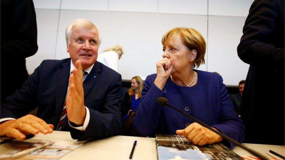 Bavarian premier and leader of the CSU, Horst Seehofer, with Angela Merkel, 26 September 2017