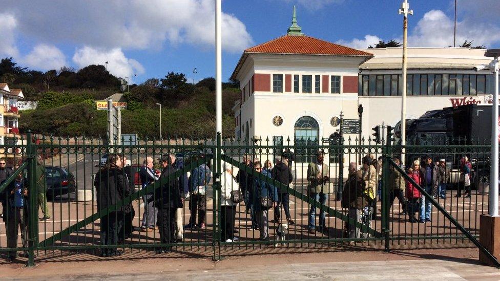 Members of the public queue to be among the first on the new Hastings Pier