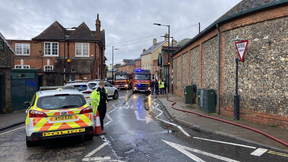 Police and fire crews outside Greene King brewery