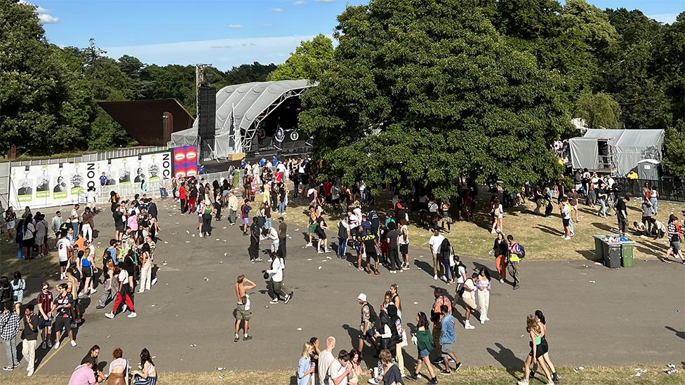 The view of the stage obscured by trees