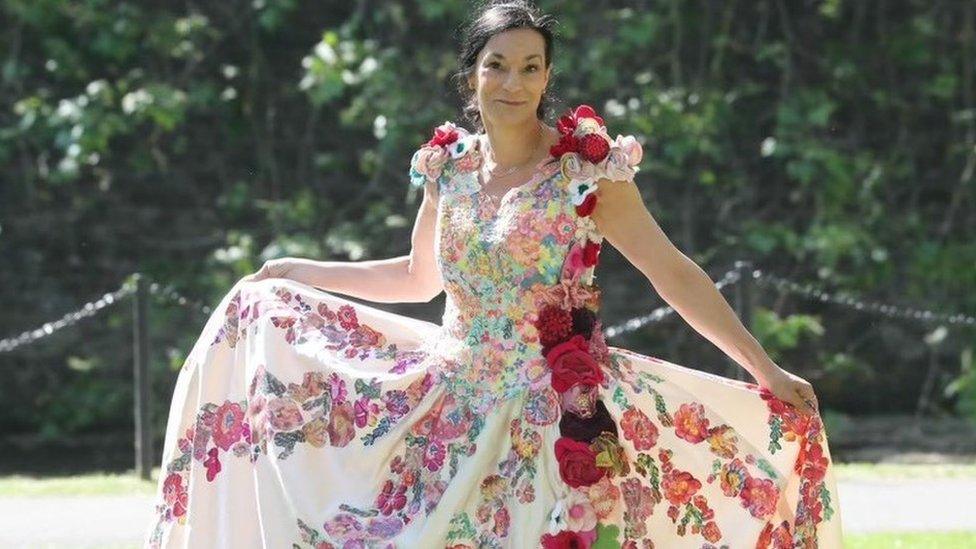 Ms Pullins in a dress that has been embroidered and coloured in