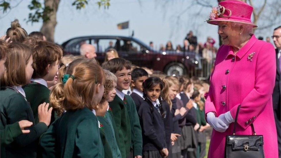 Queen speaking with school children