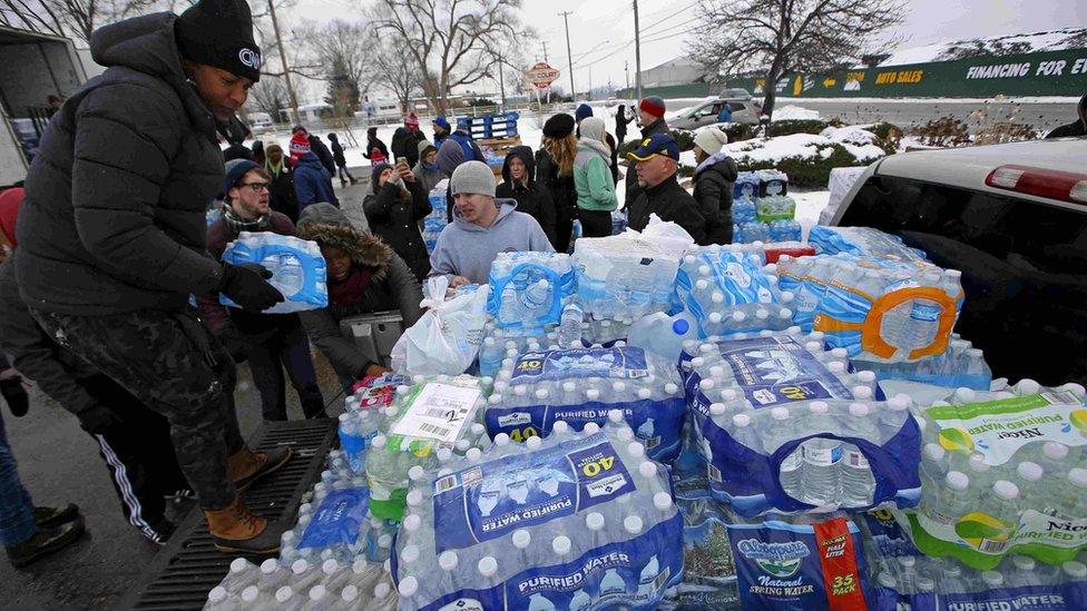 Volunteers distributed bottled water at the height of the crisis