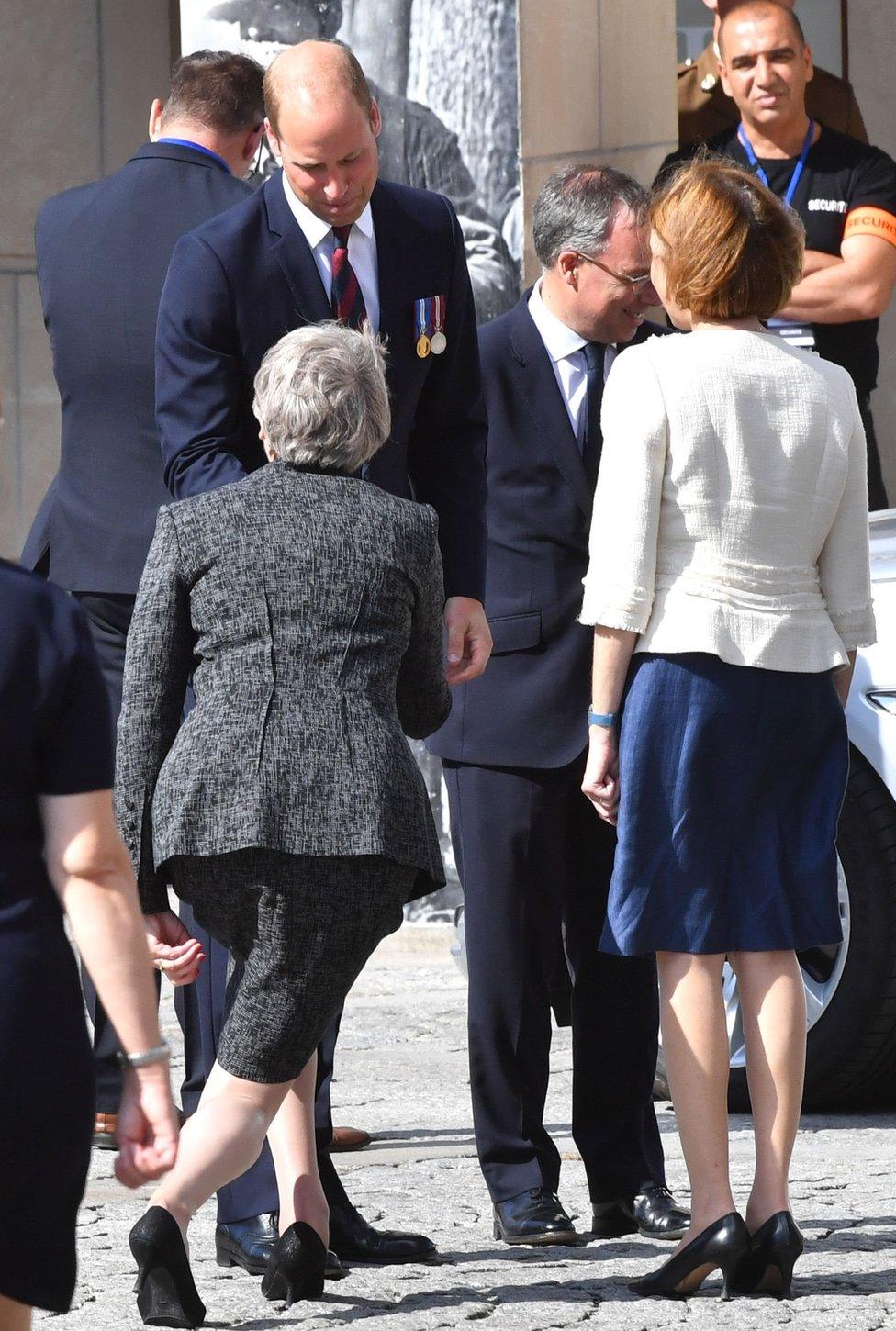 Prince William greets Theresa May as they arrive at the commemoration marking the 100th anniversary of the Battle of Amiens, held at the Amiens Catheral, in Amiens, northern France