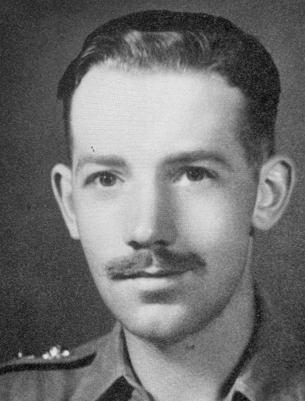 A young Captain Tom Moore poses for a portrait whilst in military uniform