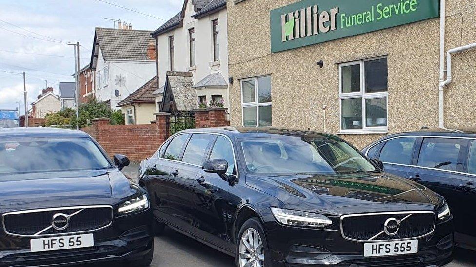 Three black limousines in front of Hillier Funeral Services