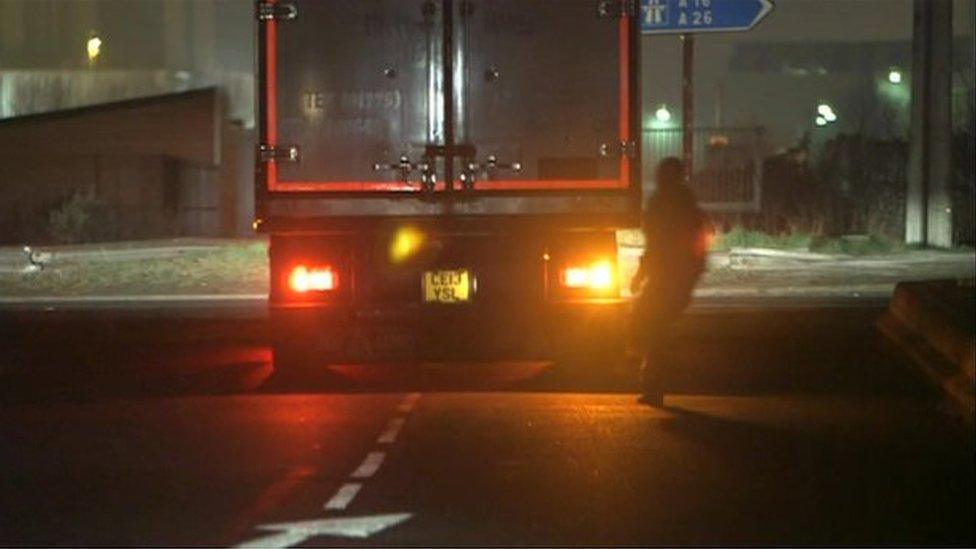 Migrant running towards truck