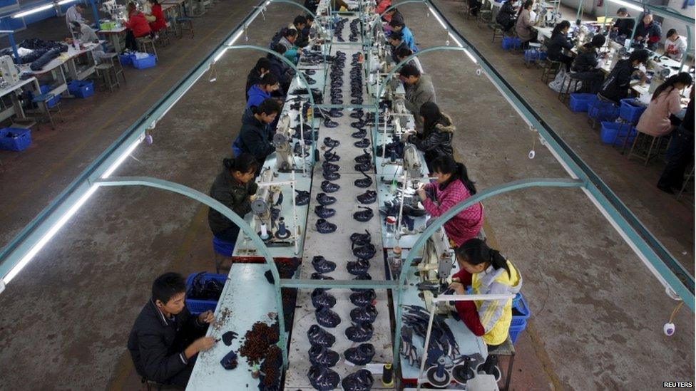 Employees work at a shoe factory workshop in Suining, Sichuan province, China, in this 29 October 2010 file picture