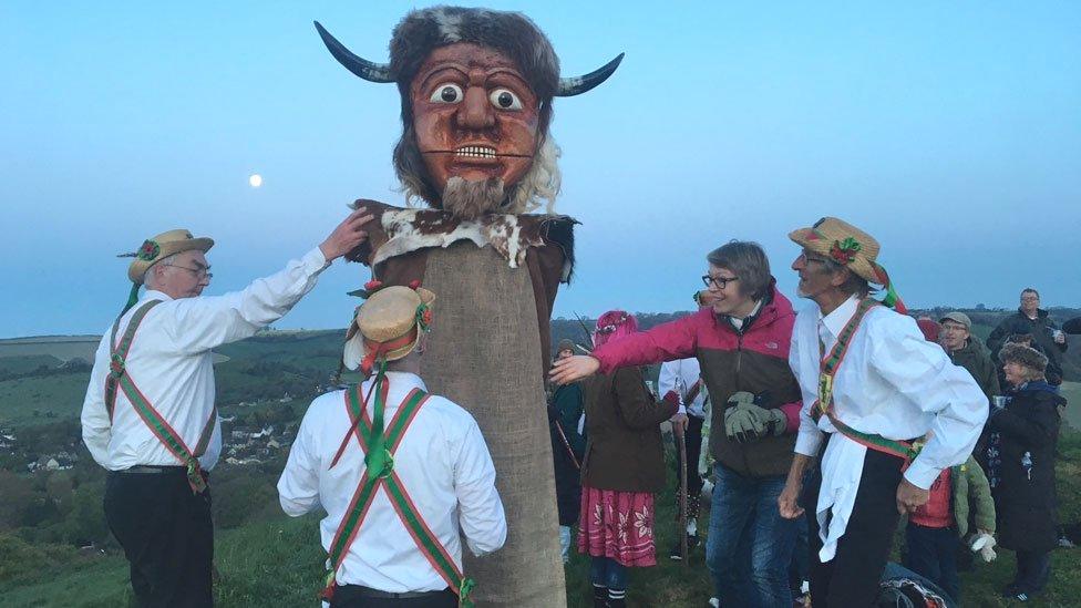 Wessex Morris Men welcome the May Day sunrise by the Cerne Abbas giant, Dorset