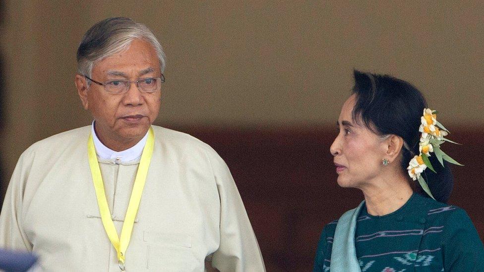 Htin Kyaw, left, newly elected president of Myanmar, walks with National League for Democracy leader Aung San Suu Kyi, right