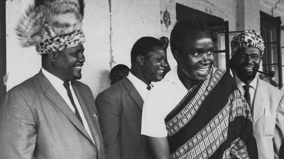 Kenneth Kaunda, leader of the Northern Rhodesian African Nation Congress, and Joshua Nkomo (left), leader of the banned Zapu (Zimbabwe African People's Union) party of Southern Rhodesia, attend the ceremony for the swearing-in of Dr Hastings Banda as the first prime minister of Nyasaland (later Malawi), in the legislative assembly at Zomba, January 1963