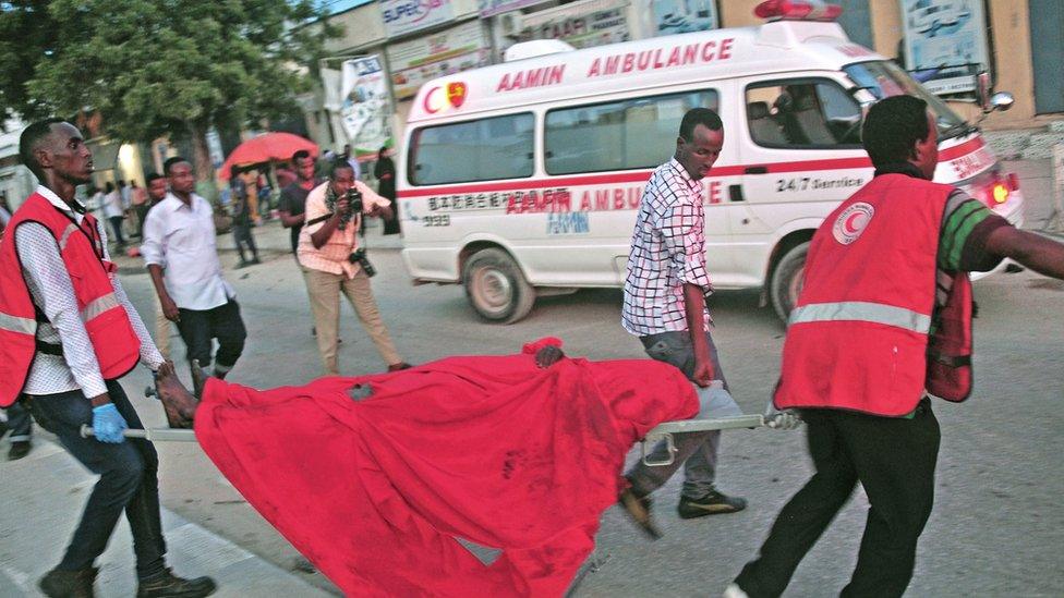 People carrying a stretcher