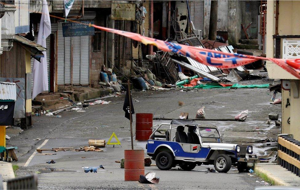 A view of the Maute group stronghold with an IS flag in Marawi City in southern Philippines 29 May 2017.