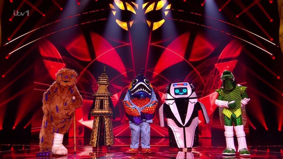 Masked singer semi-finalists on stage