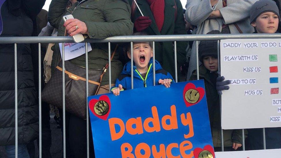 Families in Devonport at the homecoming of HMS Montrose