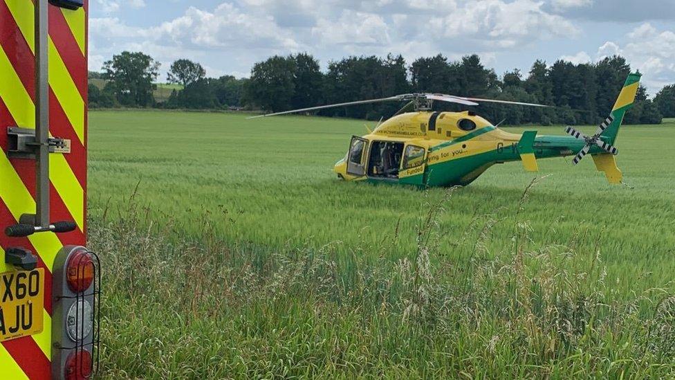 Helicopter landing on a field