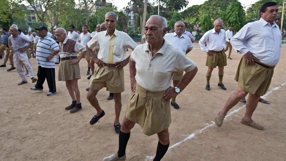 Indian senior swayamsevaks, or volunteers, from the Rashtriya Swayamsevak Sangh (RSS), the country's biggest grassroots religious group, excercise during the Shakha