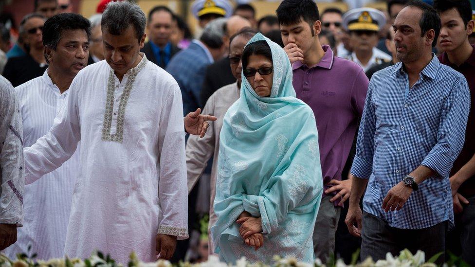 Family members of a Bangladeshi policeman mourn his death