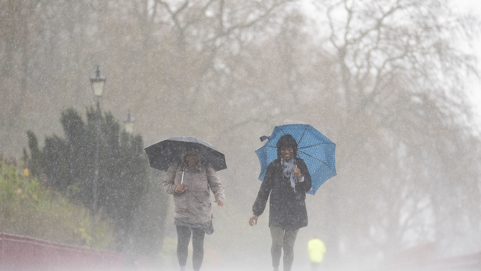 People braving the rain in Battersea Park on Easter Monday