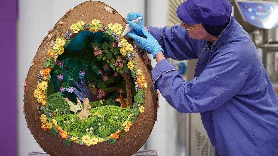 Cadbury World chocolatier Dawn Jenks adds the finishing touches to the Easter-themed chocolate creation at Cadbury World in Birmingham