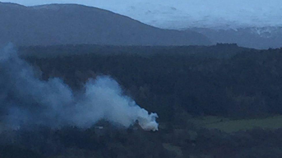 Smoke rising from the scene of the fire at Boleskine House