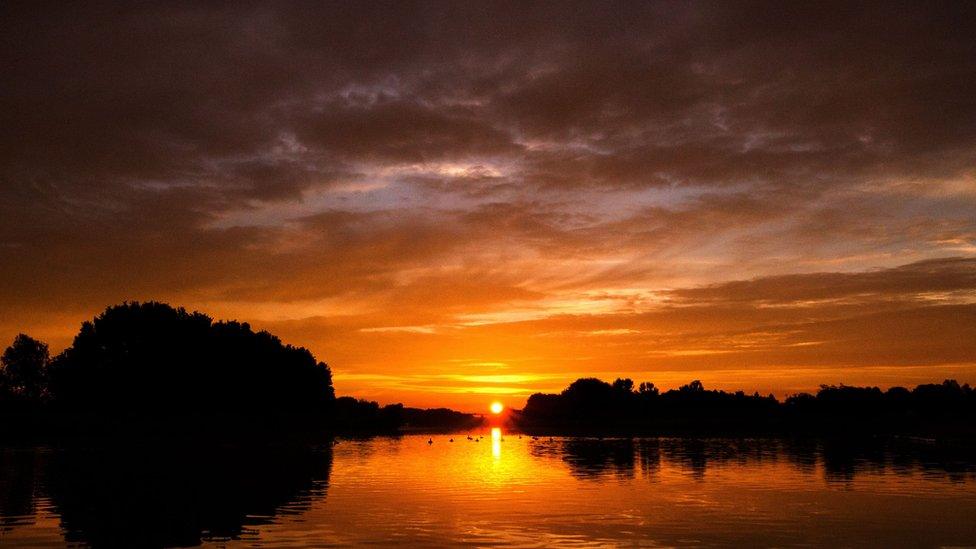 A sunset over a lake