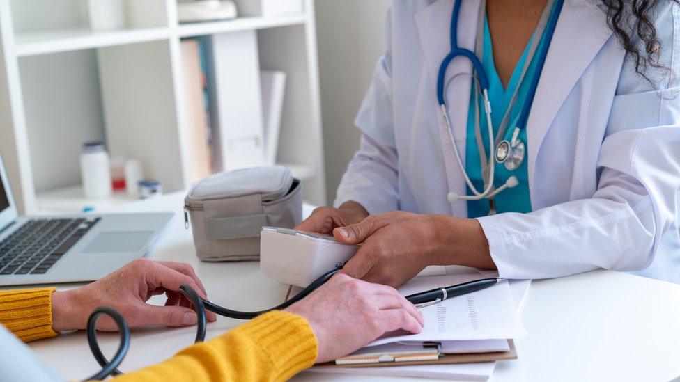 Doctor with patient (stock photo)