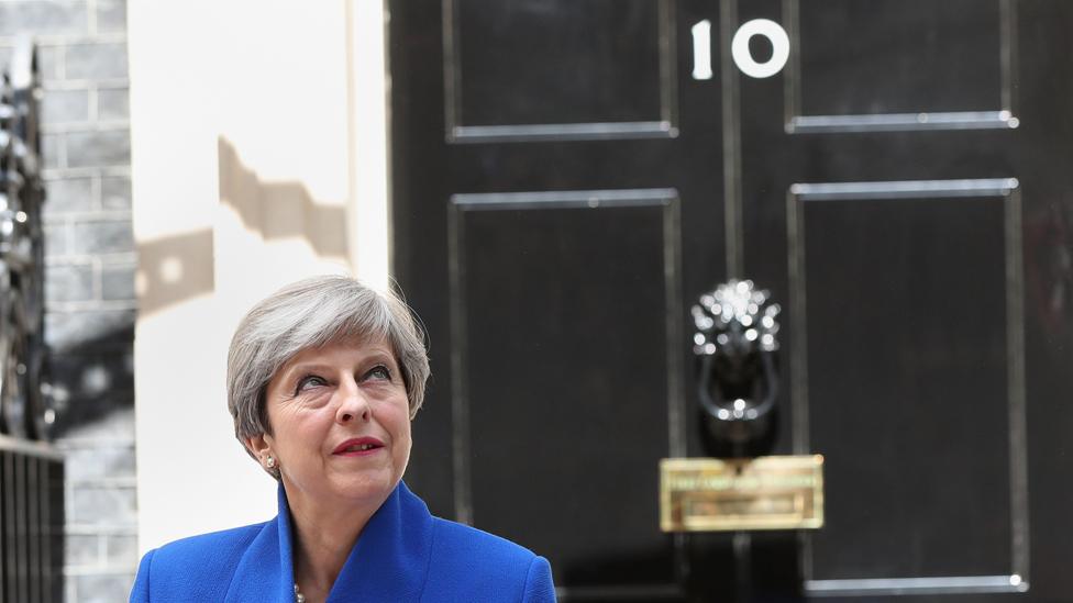 Prime Minister Theresa May pictured in front of 10 Downing Street on 9 June after she travelled to Buckingham Palace for an audience with Queen Elizabeth II following the General Election results.