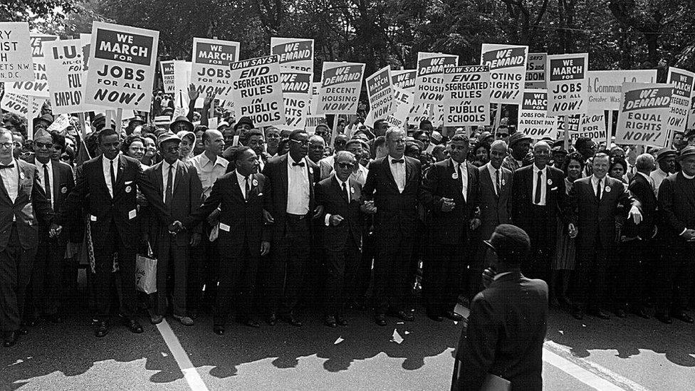 Rev. Martin Luther King and other civil rights leaders march at a civil rights rally August 28, 1963 in Washington.