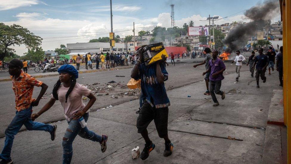 People run through the streets