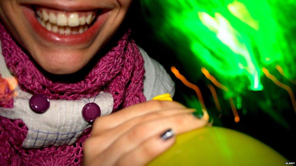 woman taking laughing gas