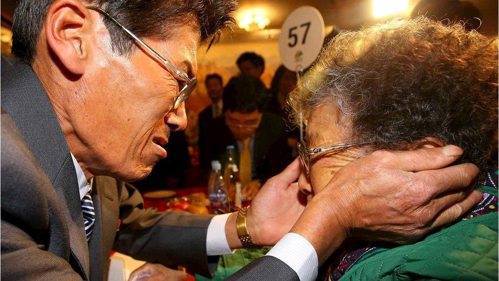 Jung Kun Mok (L) reacts as he meets his mother Lee Bok Sun during the separated family reunions at Mount Kumgang resort, North Korea, October 24, 2015