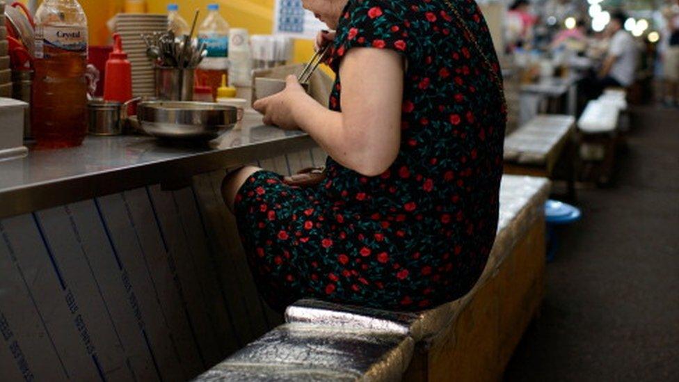 A woman eating alone in Seoul