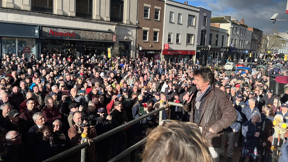 Richard Hammond speaking in front of the crowd