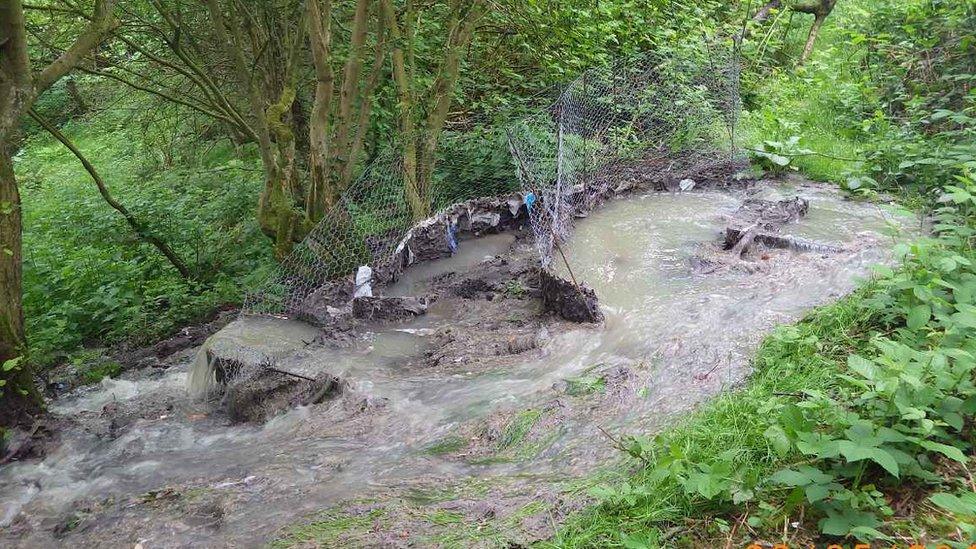 Sewage discharging from a manhole cover