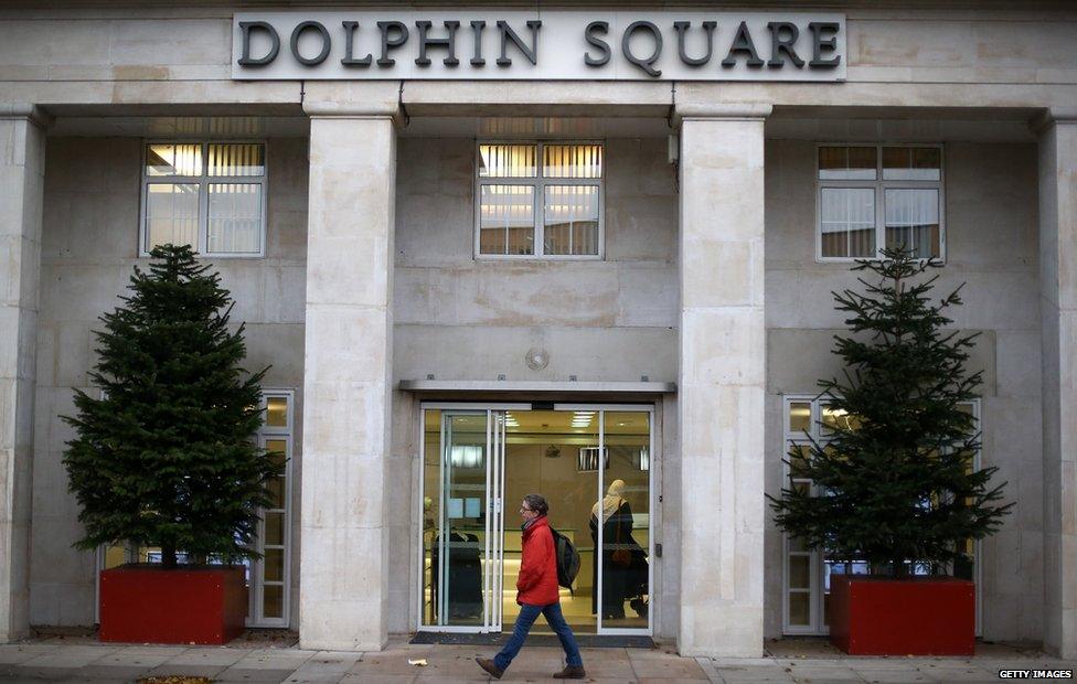 Man walks past front of Dolphin Square