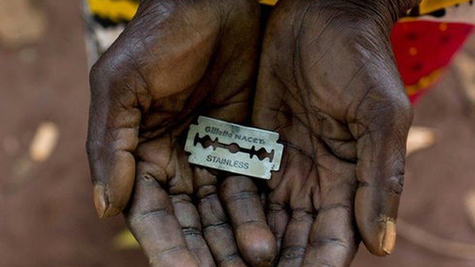 An FGM "cutter" in Kenya shows the razorblade she uses to cut girls' genitals