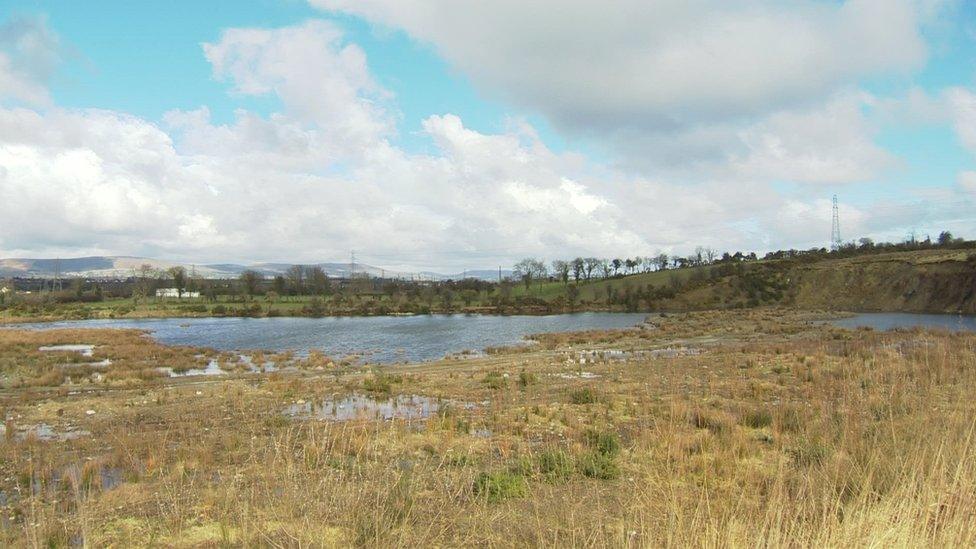 The site stretches across both sides of a country road